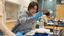 Female student using science equipment