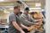Professor helps student learn equipment