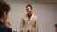 Male professor smiles at class