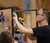 Male student uses a drill