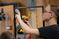 Male student uses a drill
