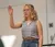 Female student conducts in front of class