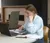 A female student works on a laptop in the library