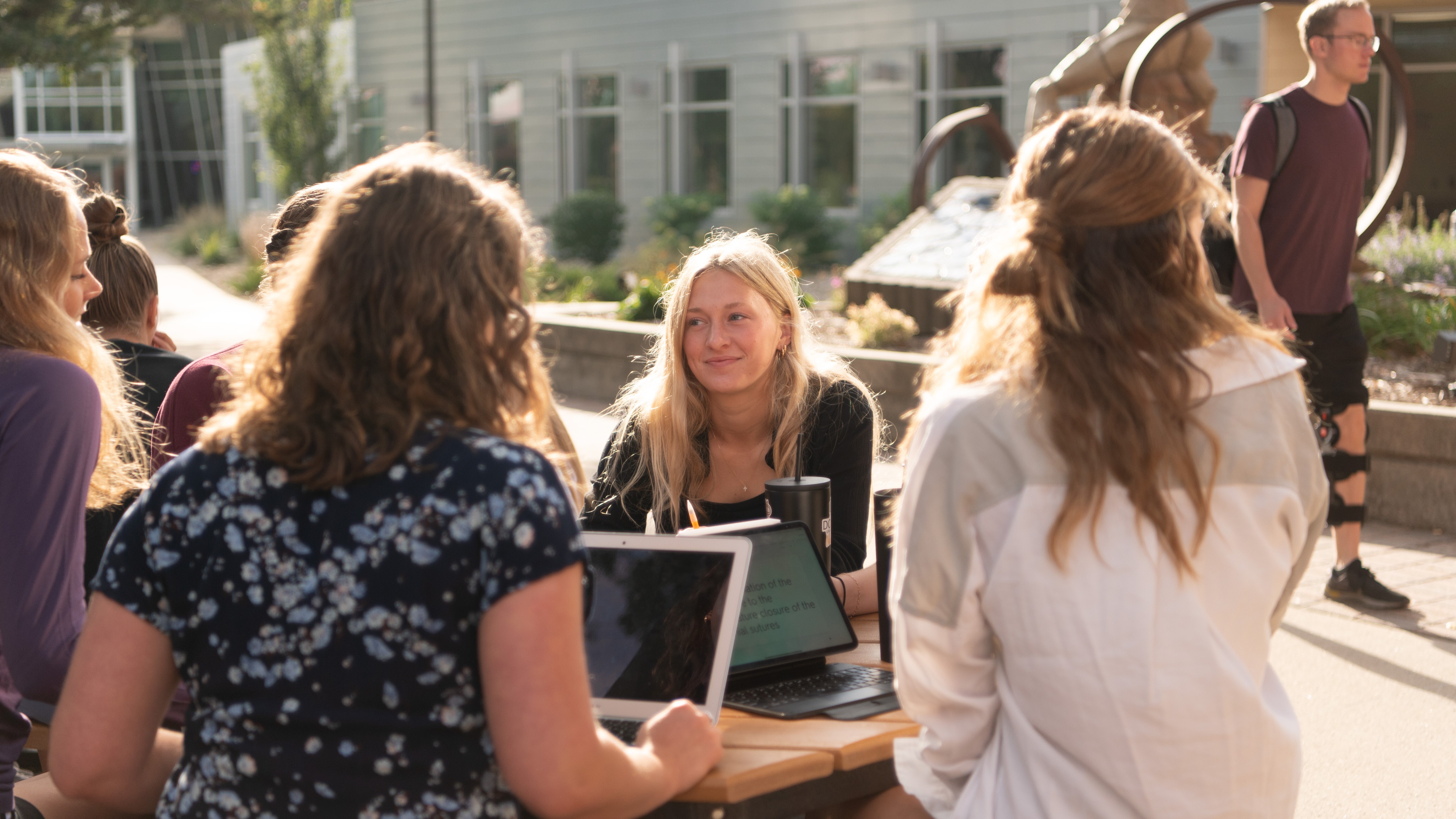 Female student sitting in a discussion