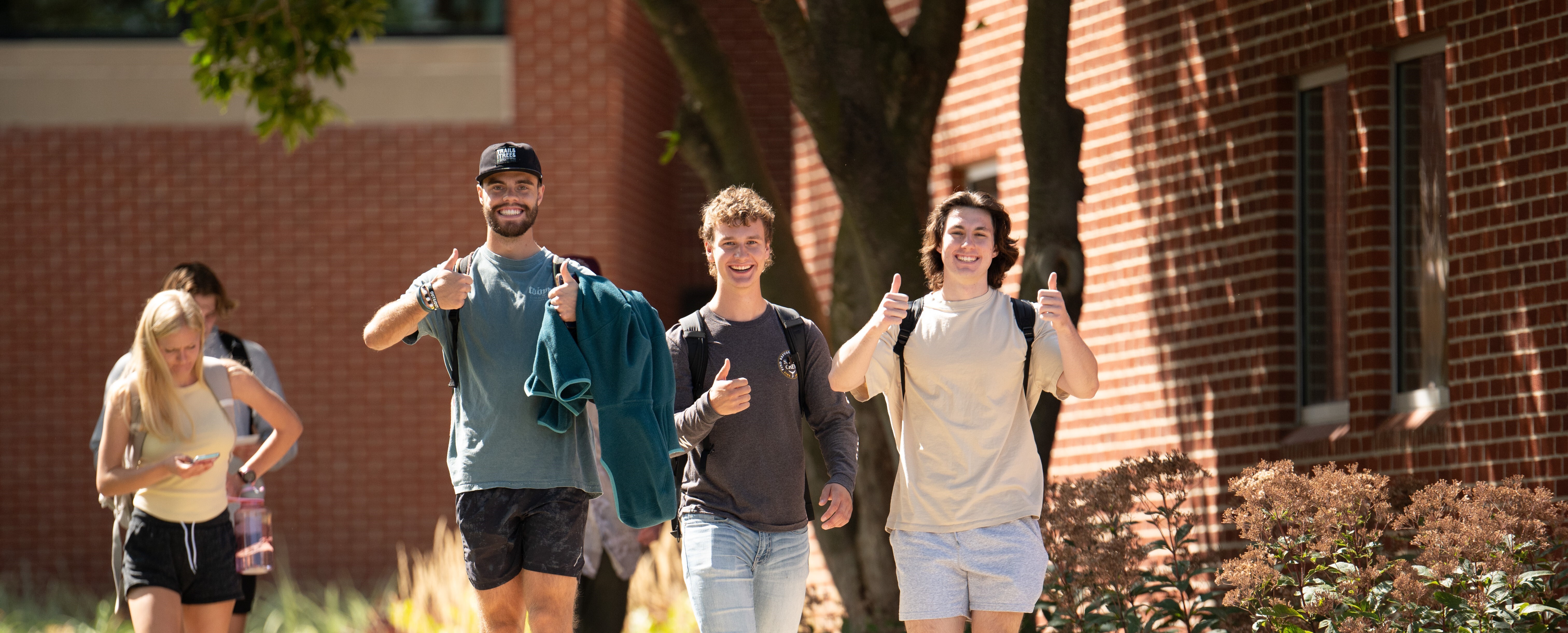 Male students walking on campus