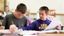 Male student helps classmate