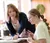 Female teacher helps her student