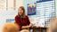Female teacher reads her class a book