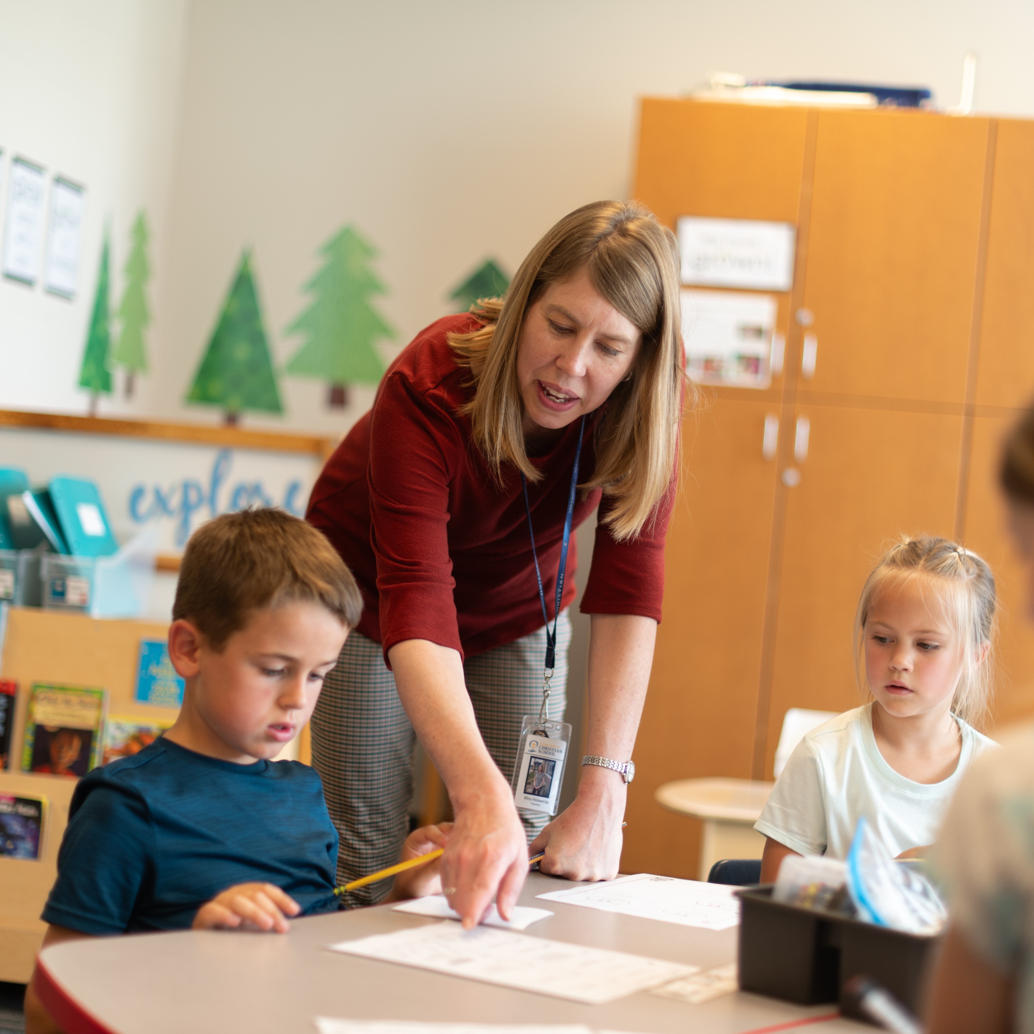 Female showing her student the directions