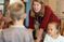 Female teacher helps her students