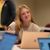 Female student looks up from her computer