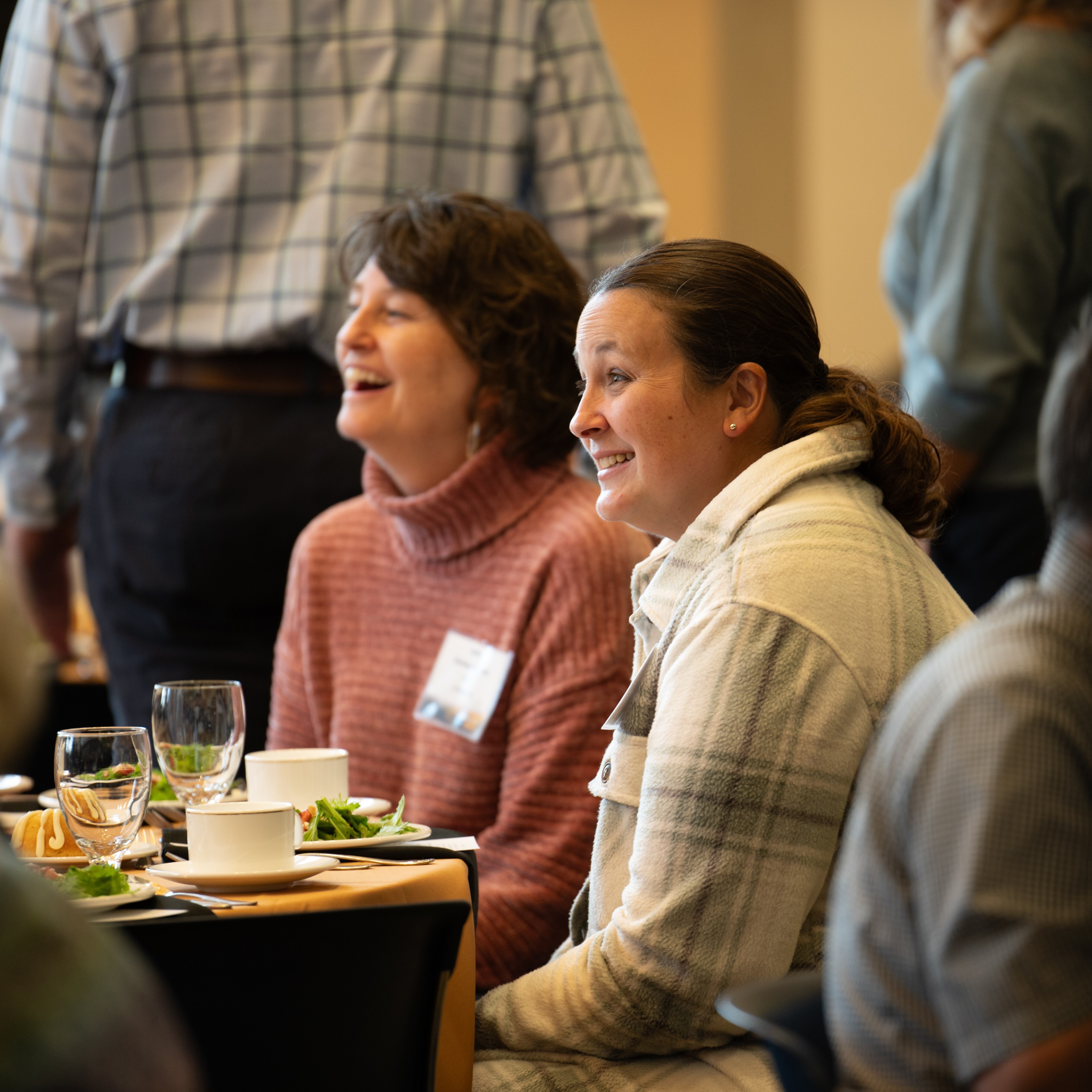 Females smiling at banquet