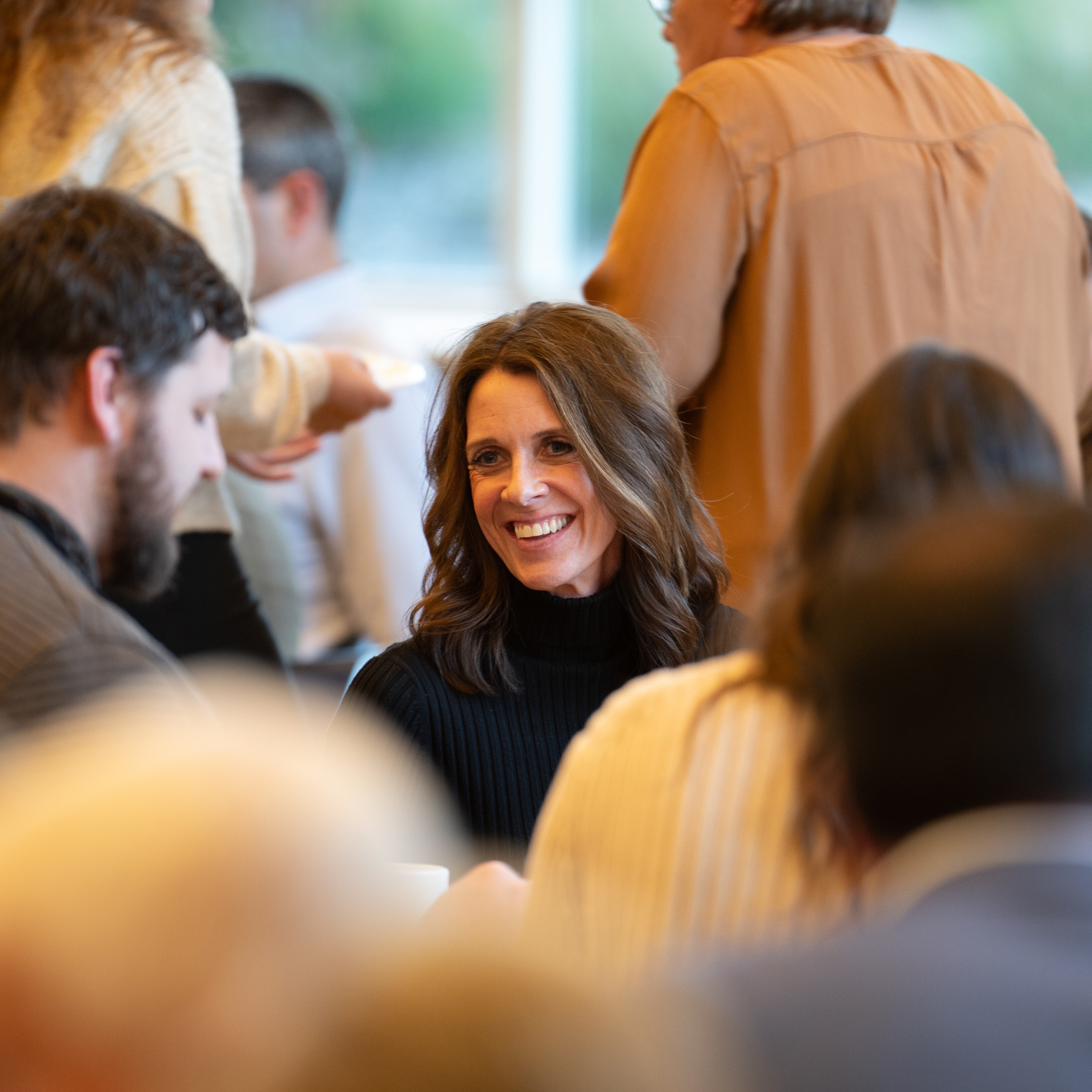 female smiling at a banquet