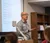 Male professor speaking in front of class