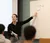 female professor points to the board