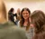 Female student listens to her peer's presentation