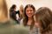 Female student listens to her peer's presentation