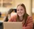Female student glances up from her computer