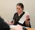 Female student looking through paperwork