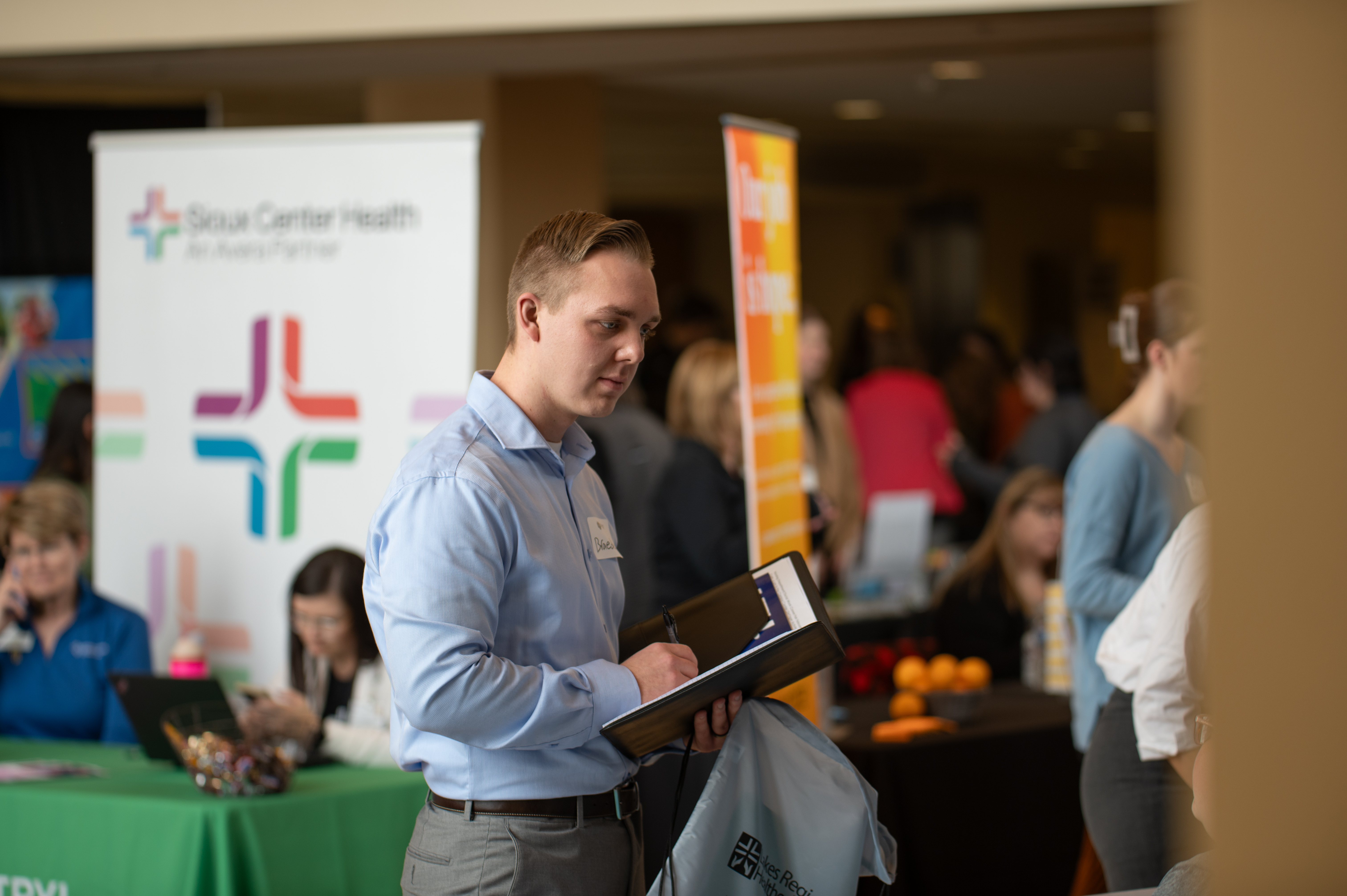 Male student learns more about health center