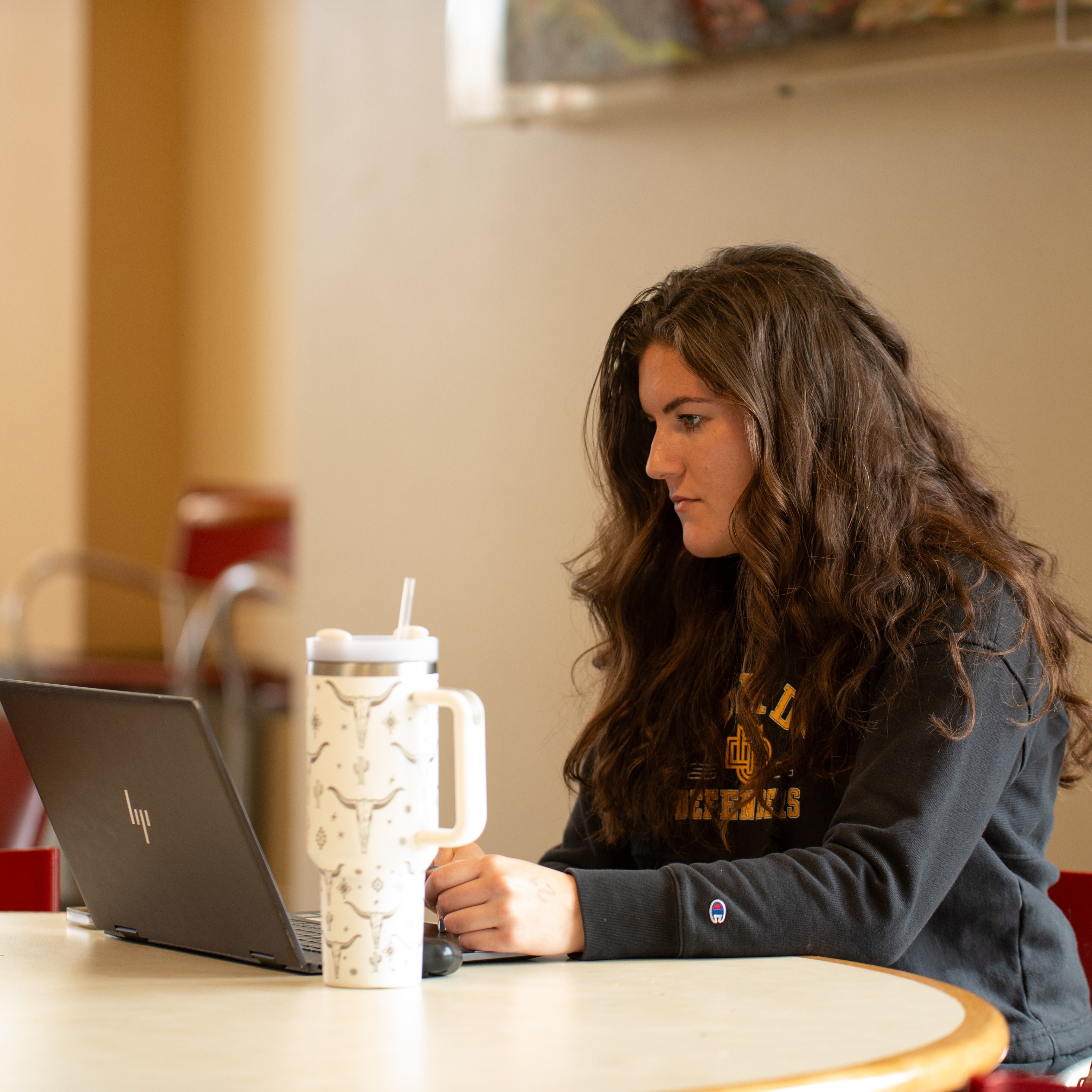 Female sitting at her computer