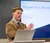 Male student speaks in front of class