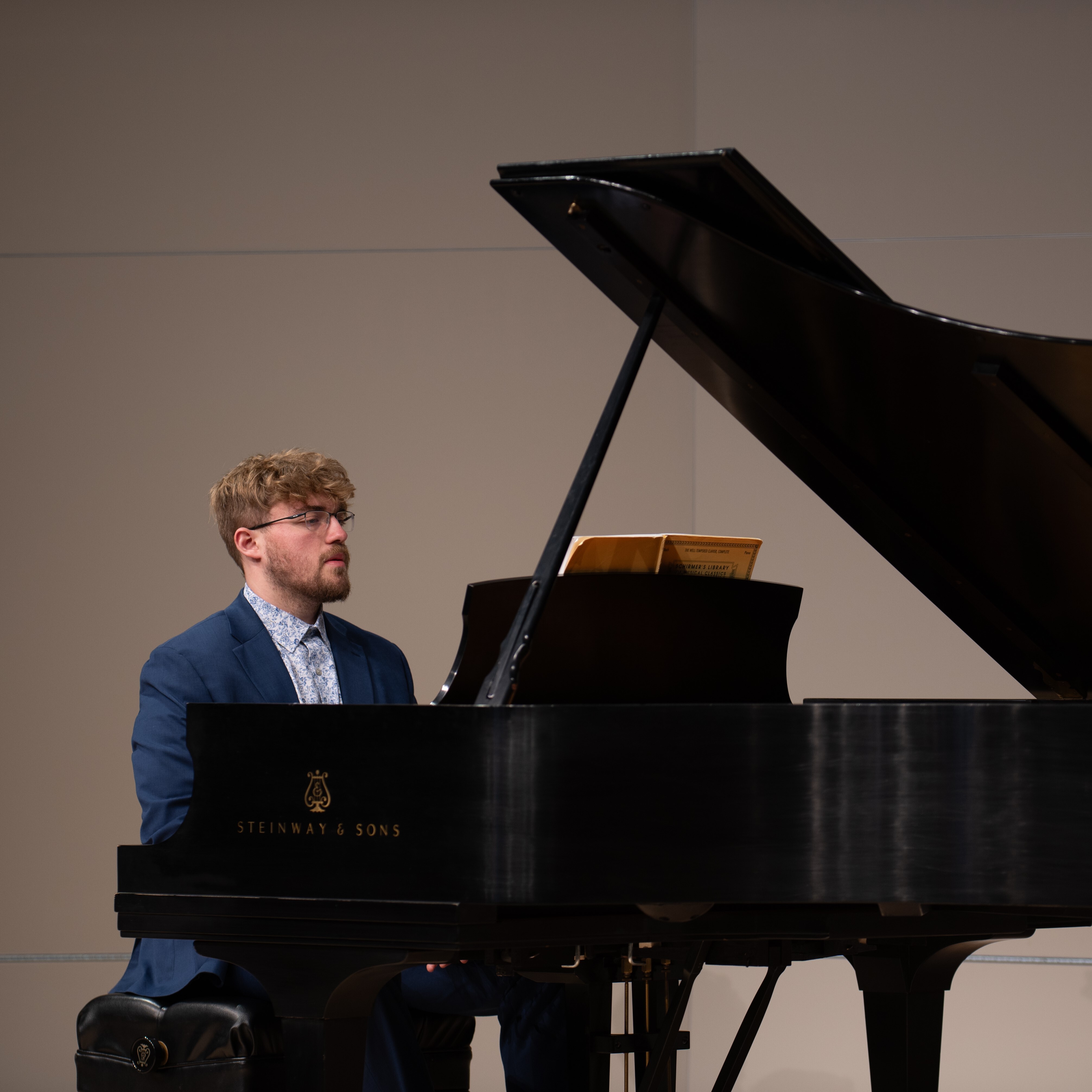 Male student playing the piano