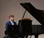 Male student playing the piano