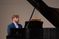 Male student playing the piano