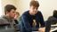 male student sitting at their desk