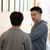 Male students speaking to each other