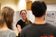 Female student listens while she receives feedback from her peers