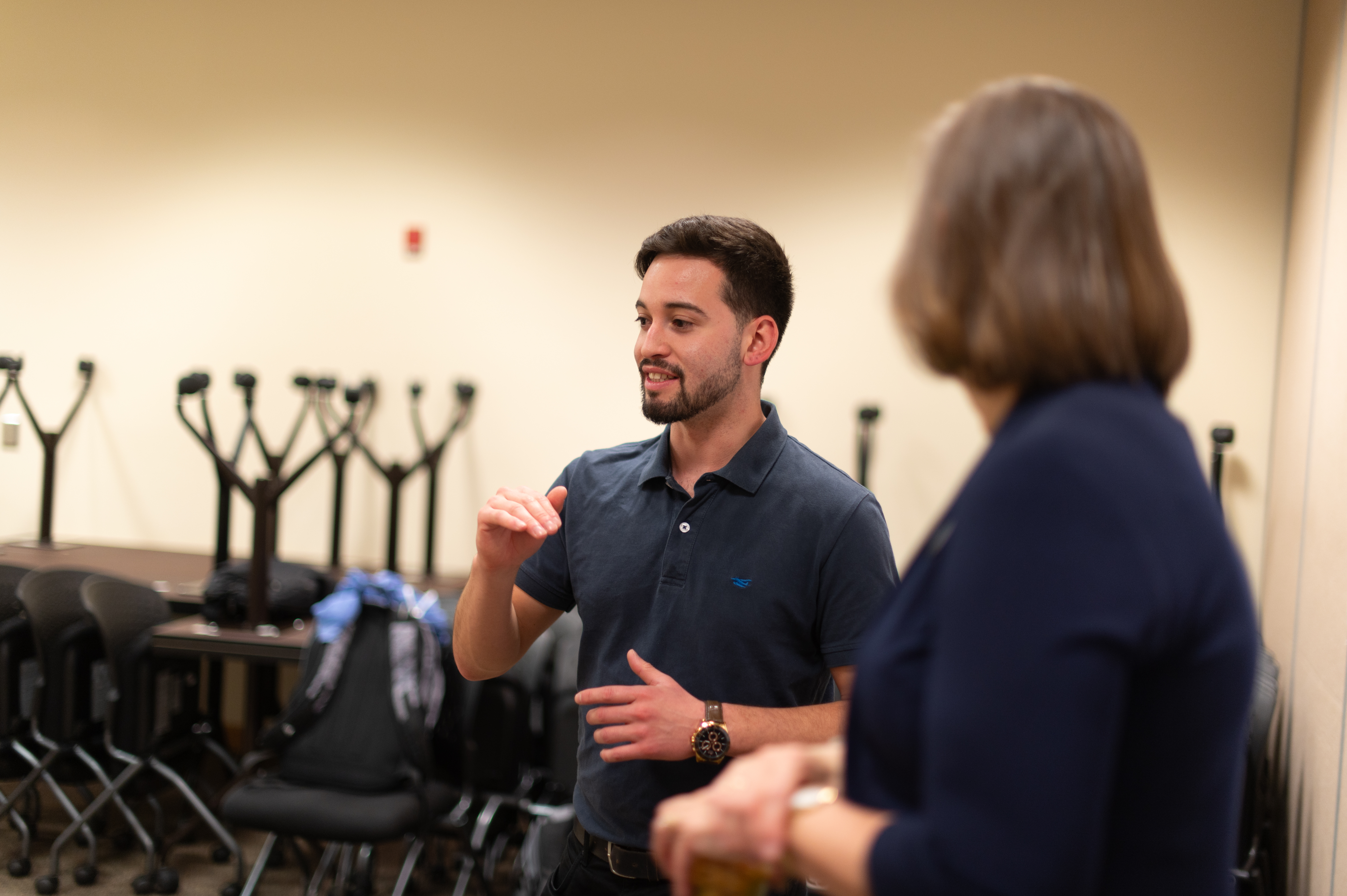 Male student uses his hands to communicate