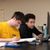 Male students sitting in class