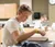 Male student sitting in science lab