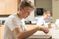 Male student sitting in science lab
