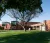 Brick building with two glass cubic areas and nice lawn