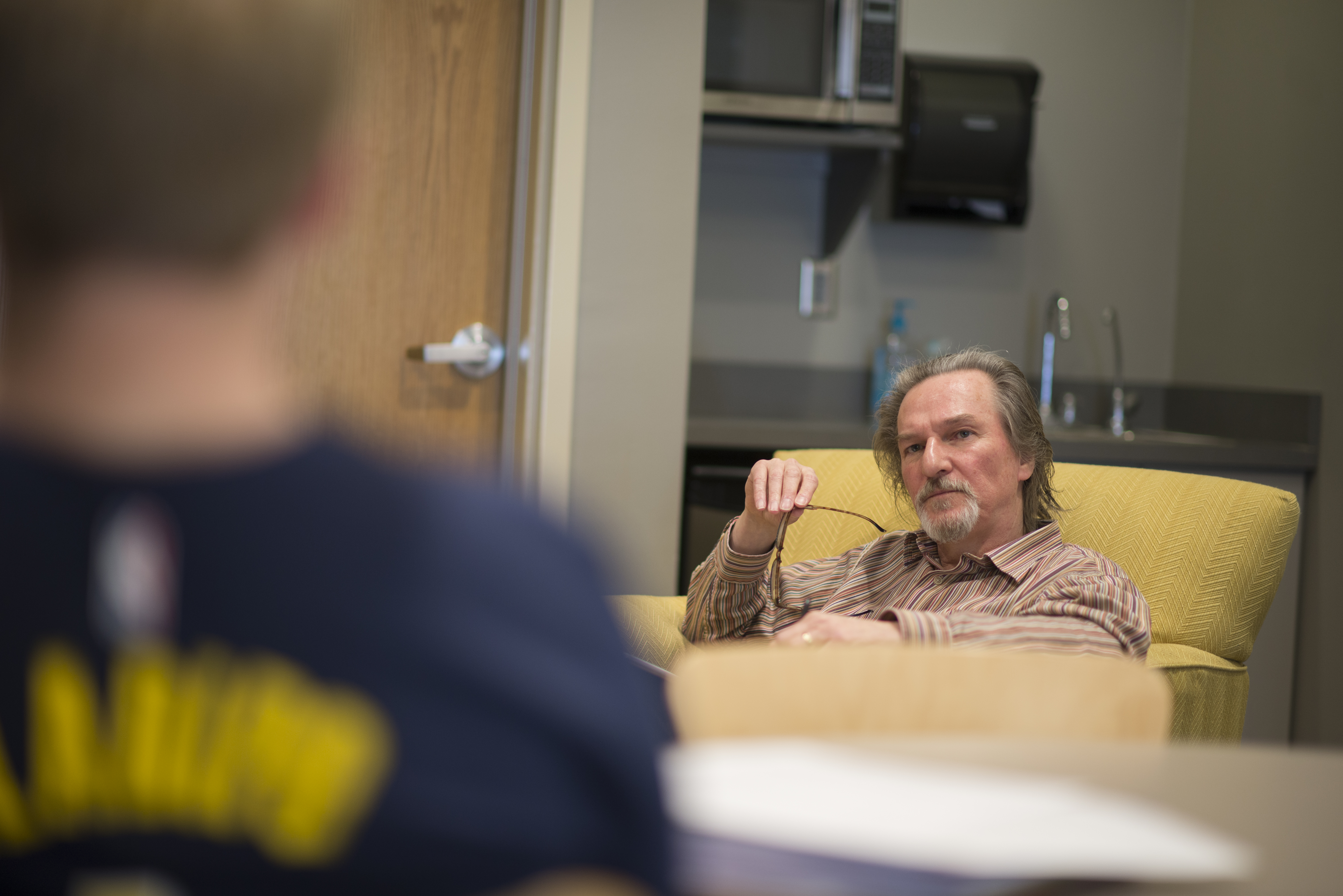 A picture of Dr. Tazlaar sitting in a chair