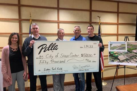 People holding up a check for the City of Sioux Center