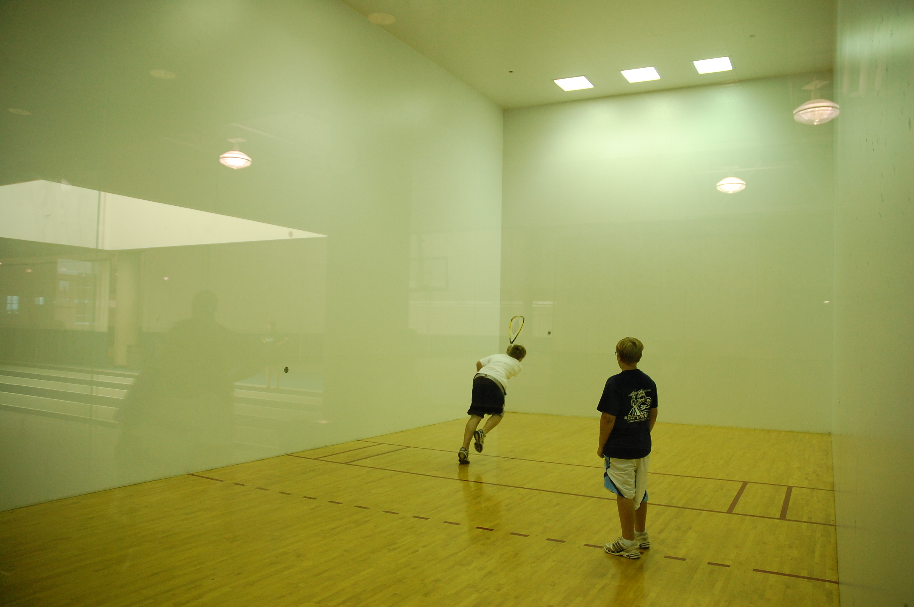 Two students play raquetball