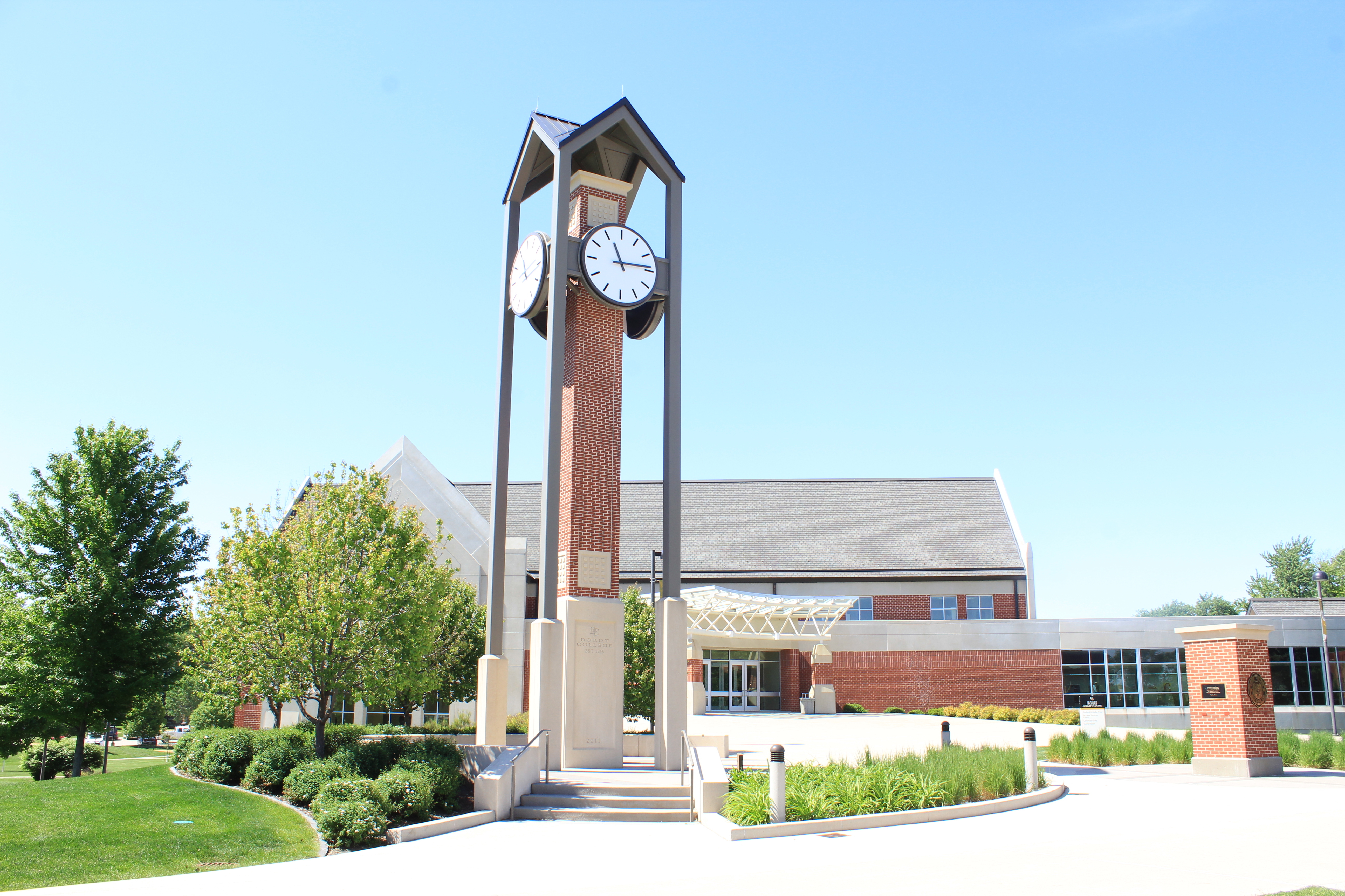 A picture of Dordt's clock tower with the campus center behind