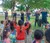 Students singing and dancing with kids