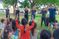 Students singing and dancing with kids