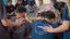 Students praying over each other