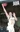 Old photo of young man playing basketball, going up for layup
