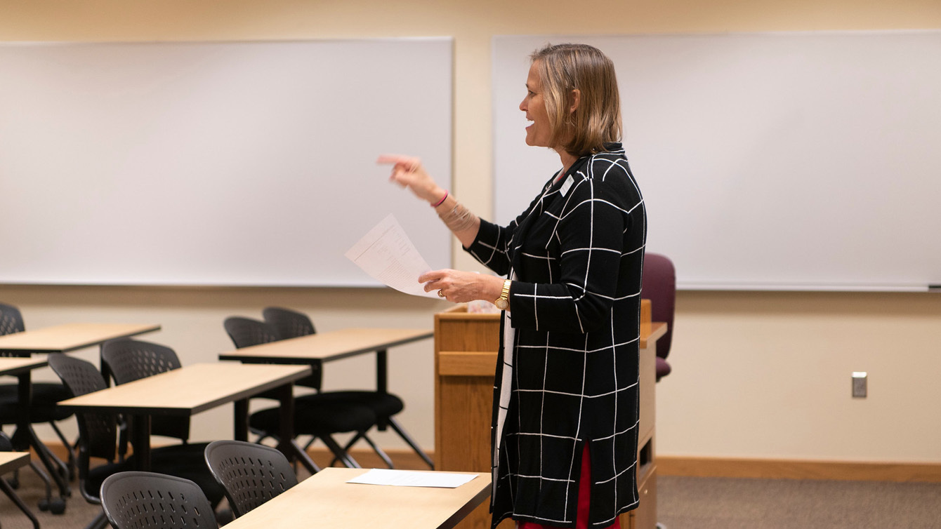 A female professor giving a lecture