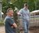 A professor and a student next to a fence at Dordts Agriculture facility