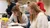 Social work students sitting down at their desk taking notes