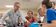 A Dordt Professor helping students with a question