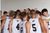 Dordt Men's Basketball in a huddle